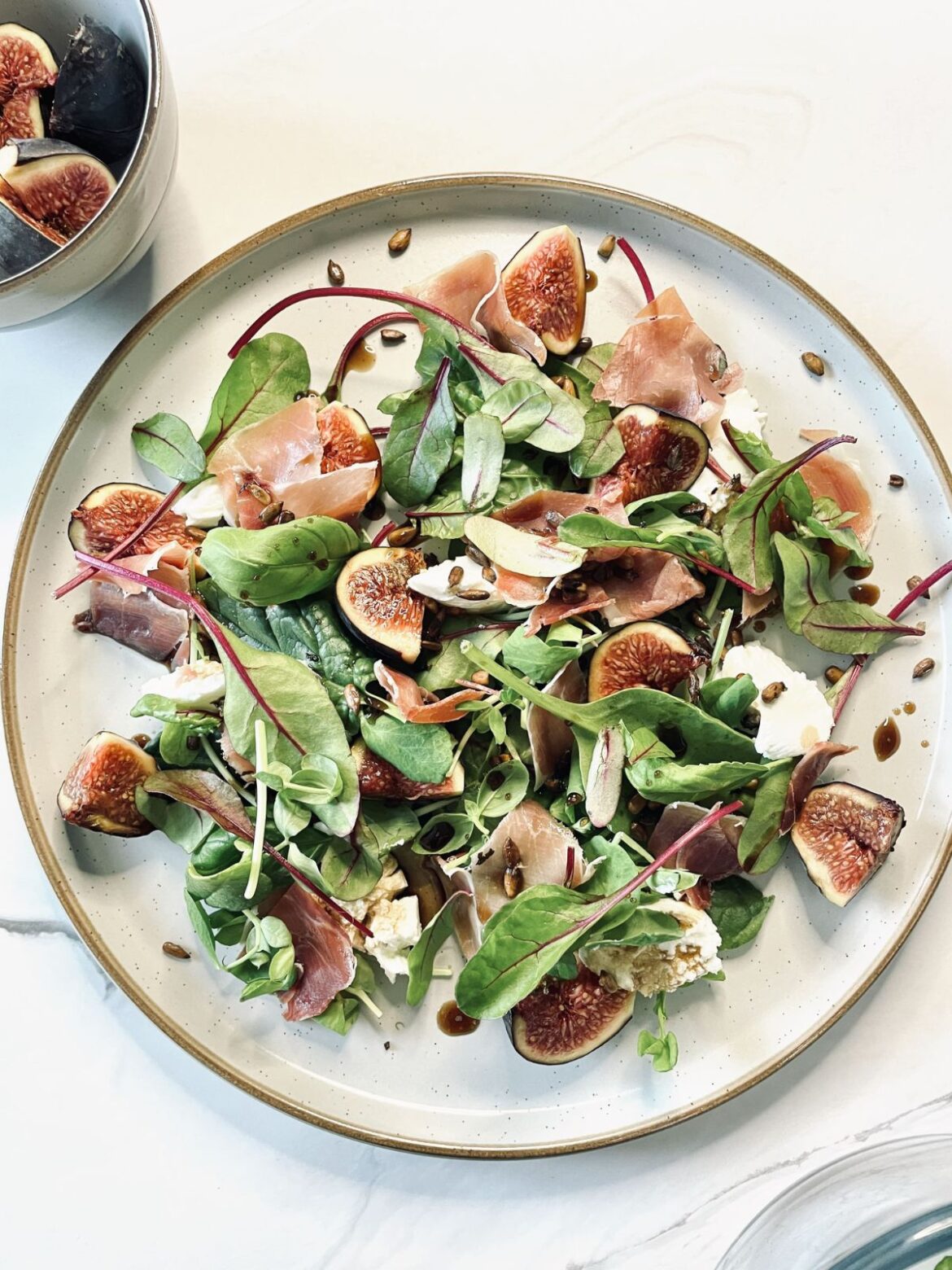A plate with Fig & Parma Ham Salad with Goat's Cheese